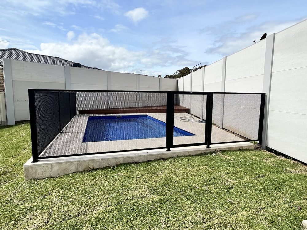 Pure Perf pool fencing in Textured Black beside a Newcastle backyard pool